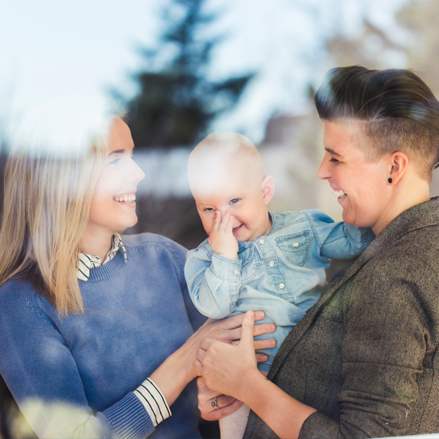 Lesbian couple happy with a baby