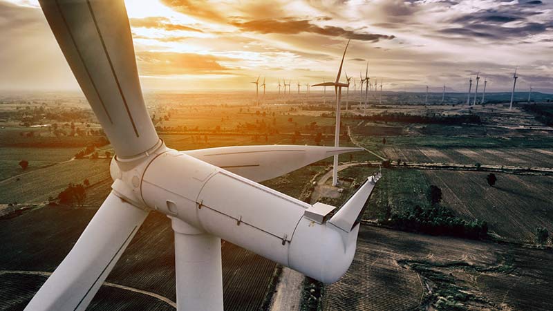 Aerial view of turbines on a wind farm.