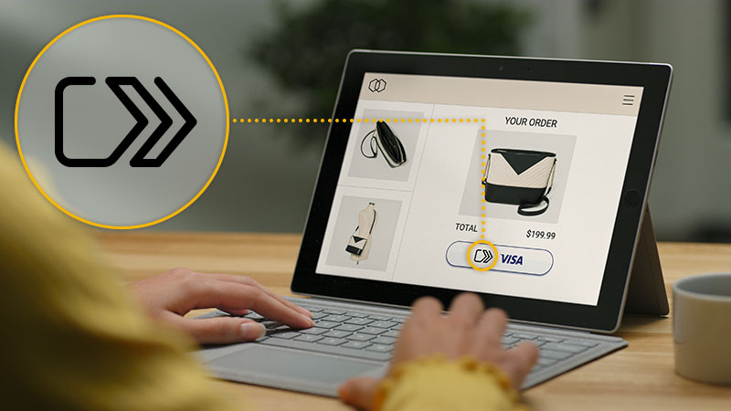 Person shopping for a purse on an ecommerce site on a tablet computer with the EMV SRC symbol overlaid