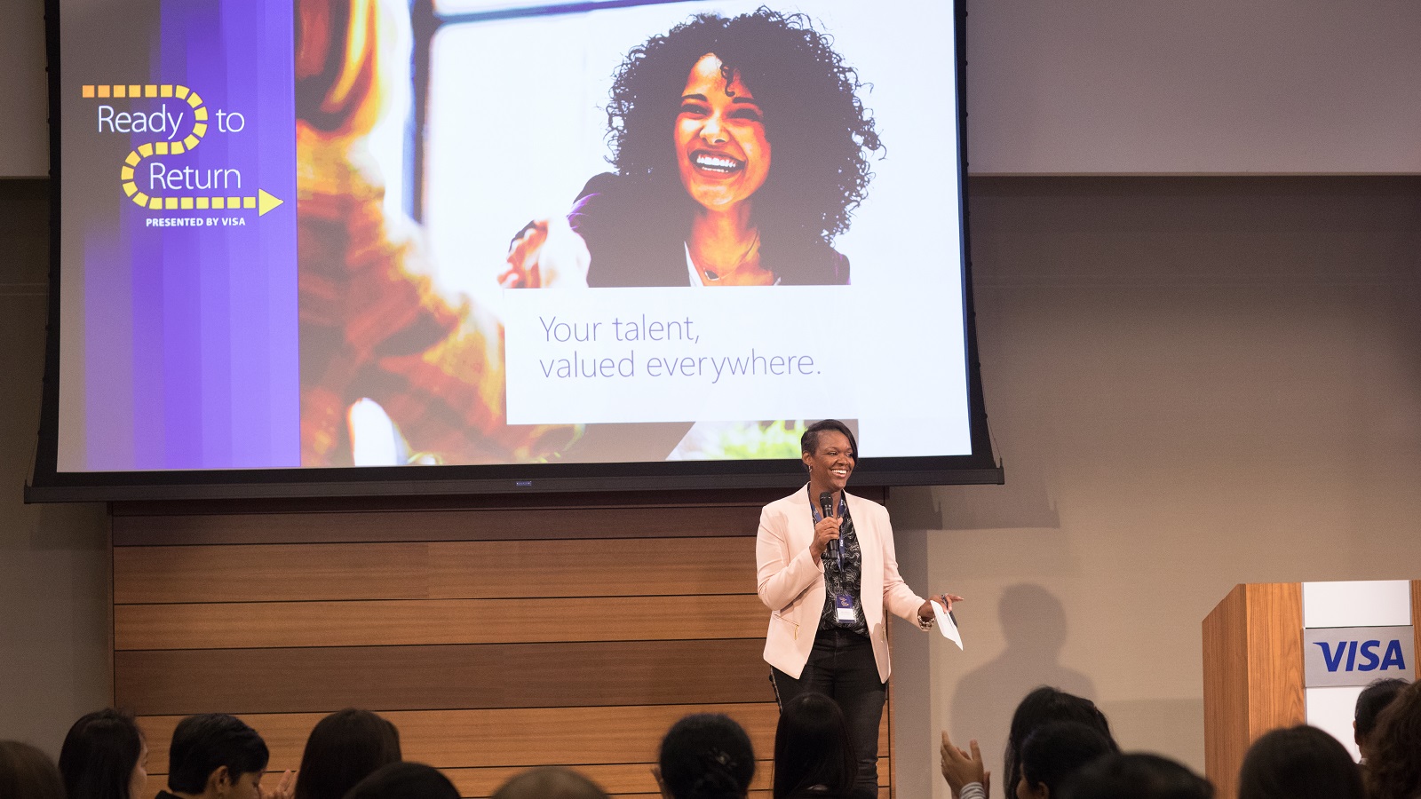 Woman giving a speech at a conference