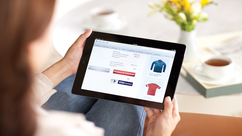 Woman looking at her online shopping cart with Visa Checkout option Woman looking at her online shopping cart with Visa Checkout option