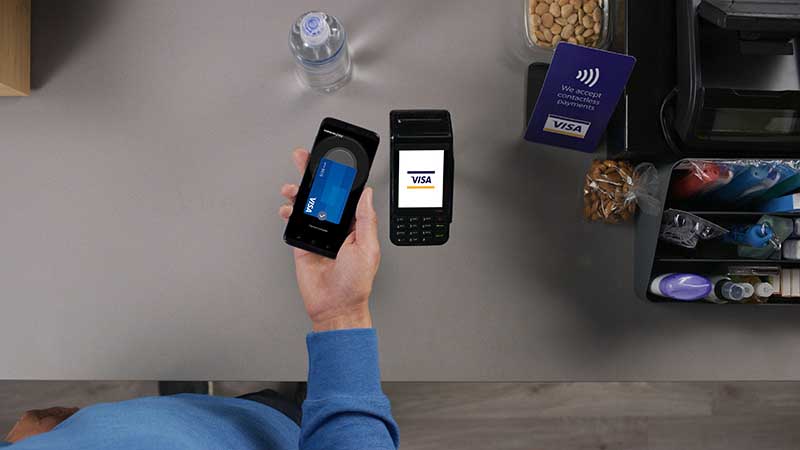 Customer paying his purchase via Samsung pay on his phone. Customer paying his purchase via Samsung pay on his phone.