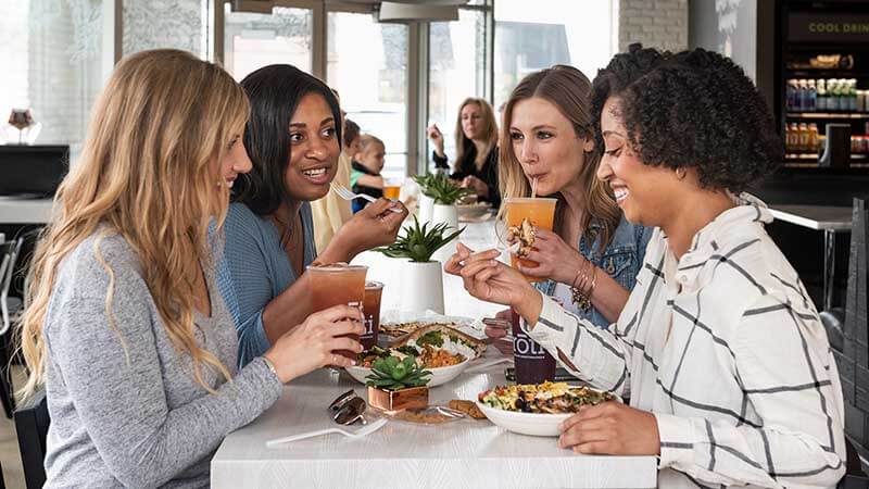 lifestyle-800x450 Women eating Mediterranean food at a restaurant.