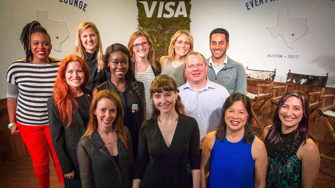 A group of Visa employees celebrating International Women’s Day posing for a group picture.