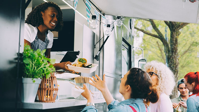 woman-selling-food-at-truck-800x450