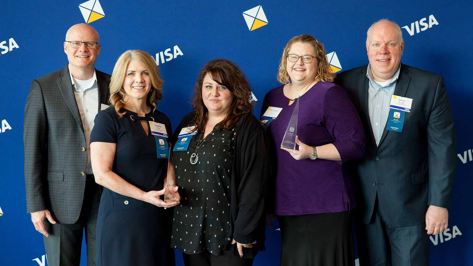 Three female and two male award winners.