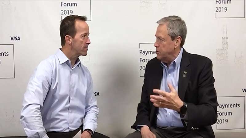 Cam Fine talking to an interviewer at the Visa Payments Forum 2019.