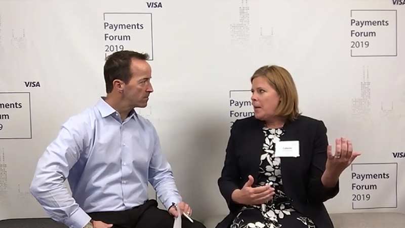 Celeste Schwitters talking to an interviewer at the Visa Payments Forum 2019.
