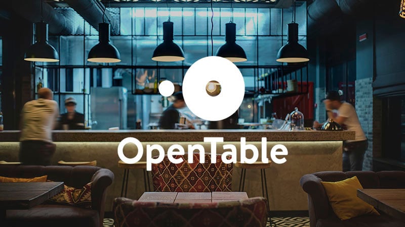 Lounge scene with OpenTable logo superimposed on it.