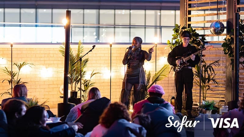 Musicians performing for an audience with Sofar and Visa logos in the lower right corner.