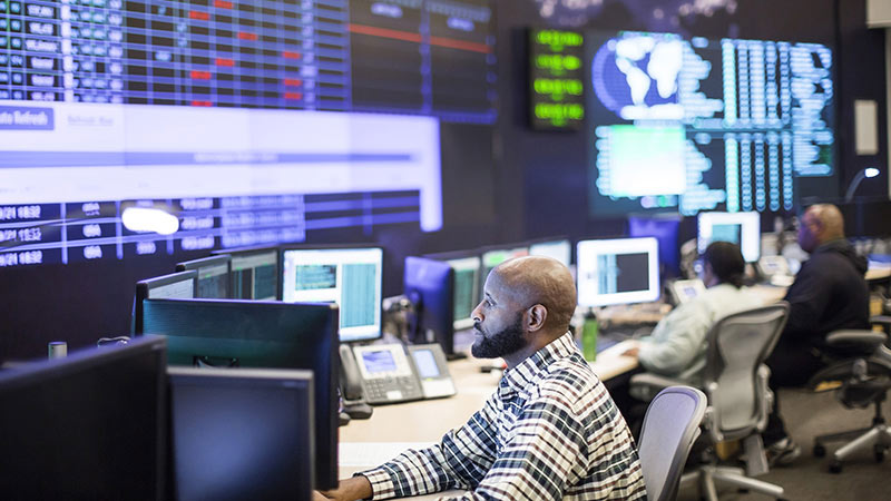 Network operations center (NOC) technicians monitoring critical network elements and engaging in proactive network systems monitoring. Network operations center (NOC) technicians monitoring critical network elements and engaging in proactive network systems monitoring.